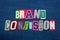 BRAND CONFUSION text word collage, colorful fabric on blue denim, marketing inconsistency
