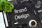 Brand Design on Black Chalkboard. 3D Rendering.