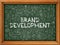 Brand Development - Hand Drawn on Green Chalkboard.