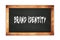 BRAND  IDENTITY text written on wooden frame school blackboard