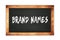 BRAND  NAMES text written on wooden frame school blackboard