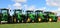 brand new John Deere Tractors on the grass with blue sky