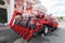 Brand new red agricultural seeder.