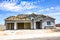 Brand New Stucco Home Under Construction With Three Car Garage