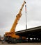 Brand new telescopic crane on a big truck in a building under construction