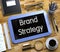 Brand Strategy on Small Chalkboard. 3D