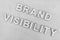 Brand Visibility message on desk with monotone editing, concept of building a successful business