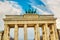 Brandenburg Gate Brandenburger Tor details in Berlin, Germany during bright day with a blue sky. Famous landmark in Berlin