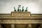 Brandenburg Gate quadriga under heavy dramatic sky