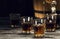 brandy in decanters stand on an oak barrel