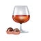 Brandy glass and chocolate candy