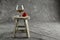 Brandy snifter and Strawberry on a Mottled background on a Small Stool