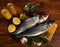 Branzino fish on cutting board