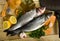 Branzino fish on cutting board