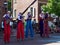 Brass Band Performing on Stilts in Street