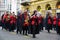 Brass band in red and black costumes at the festival parade