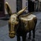 A brass figure of a donkey