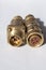 Brass four-pin electrical connector.