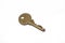 A brass house key isolated on a white background