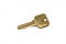 A brass house key isolated on a white background