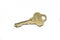 A brass house key isolated on a white background