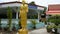 Brass iron bell hanging and monk statue in Wat Phra Kaew at Chai Nat, Thailand