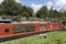 Brass items for sale on a narrowboat on an English canal