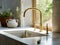 Brass kitchen water mixer tap on stone counter against of window