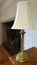 Brass lampshade standing on a sideboard