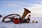 Brass musical wind instrument on snow and Christmas baubles