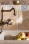 Brass water tap and granite kitchen sink.