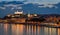 Bratislava castle at night with light reflection on the dunaj ri