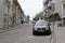 Bratislava, Slovakia - April, 2011: cars parked on narrow old street on slope.