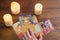 Bratislava, Slovakia, February 2017: illustrative and editorial tarot cards and burning candle on wooden table