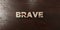 Brave - grungy wooden headline on Maple - 3D rendered royalty free stock image