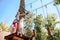 Brave kids climbs in rope park, playground