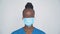 Brave proud female african nurse wear face mask looking at camera, portrait.