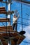 Brave teenager girl is climbing to amusement park