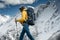 Brave tourist climb on altitude cloudy mountains. Solo traveler wearing professional backpack standing in front of high mountain