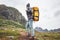 Brave tourist with travel backpack hiking in mountains outdoor journey