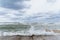 Brave waves of the Adriatic sea beating against the breakwater of the seafront in Bari, Italy