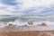 Brave waves of the Adriatic sea beating against the breakwater of the seafront in Bari, Italy