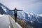 Brave Woman hiker walking to the cliff edge on mountain road, keeping balance.