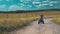 Brave young man rides a an ATV on a field