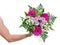 Brawny man\'s hand with a bouquet of flowers