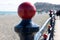 Bray, Wicklow, Ireland. Black red fence, poles on the beach Bray pebble beach towards a very distant blurred Bray Head