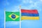 Brazil and Armenia two flags on flagpoles and blue cloudy sky