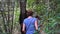 Brazil, Female Tourist Following Tour Guide in Amazonia Jungle, Slow Motion