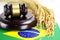 Brazil flag and Judge hammer with gold grain from agriculture farm.