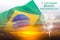 Brazil independence day concept of double exposure waving Brazil flag and sunset sky with fireworks and text